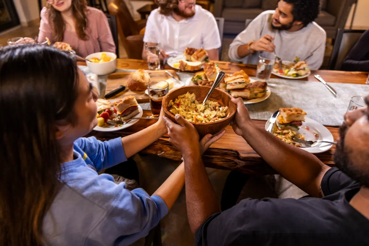 People in conversation at a shared table