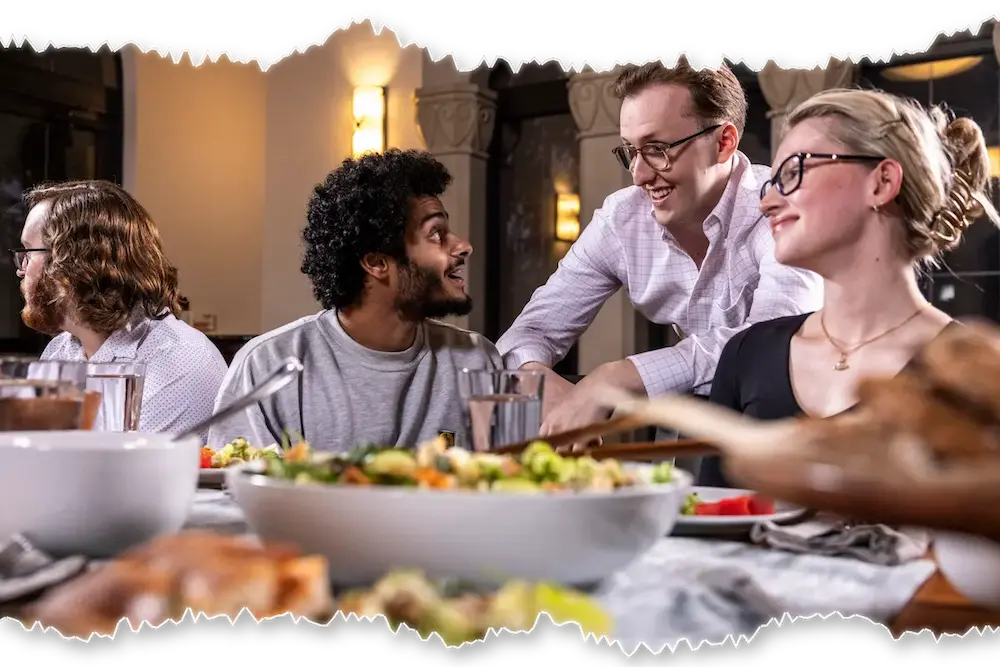 People in conversation at a shared table